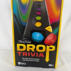 Trivial Pursuit Drop Trivia Game - Black with Red, Blue, Yellow Pieces